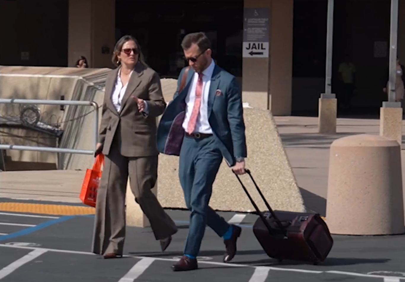 Defense lawyers leaving courthouse