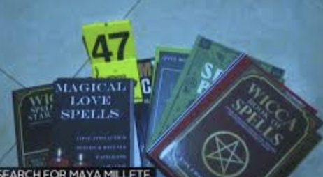 Evidence photo: spell books seized — Magical Love Spells, Wicca Spells, evidence tag #47